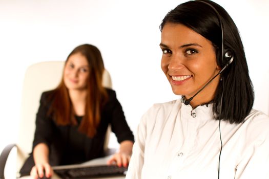 Two  office women. secretary working together on a computer