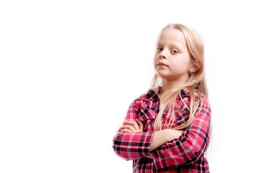 a very serious little girl on white background
