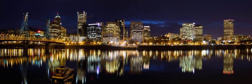 Portland Oregon Downtown Skyline alonf Willamette River Waterfront at Blue Hour Twilight Panorama