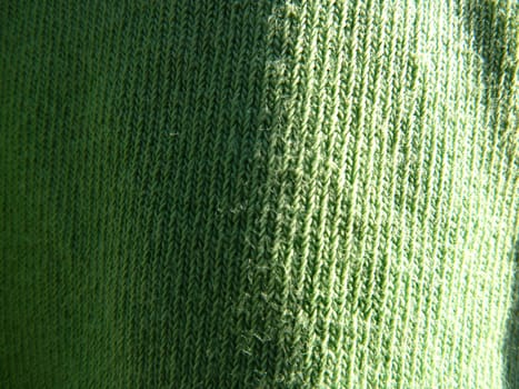green fabric with bright light and shadow