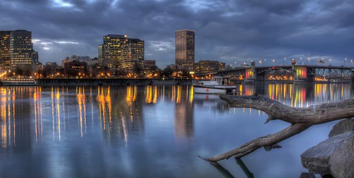 Portland Oregon Downtown Waterfront Skyline and Morrison Bridge along Willamette River at Dusk