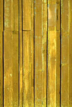 Texture of Yellow color paint plank vertical wall for background