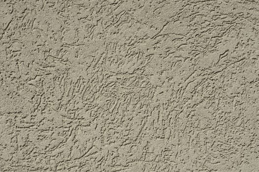 tan stucco texture for background usually found on a house or other building