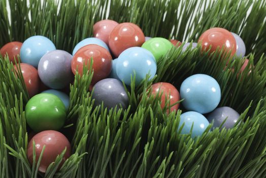 candy gumballs in grass for holiday or easter and springtime