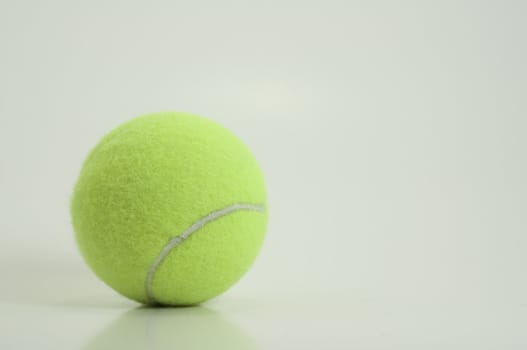 bright green new tennis ball isolated on white background