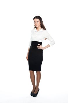 Portrait of a young and beautiful business lady in a white blouse and black skirt