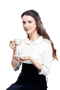 Young, beautiful and successful business woman drinking coffee from a white cup