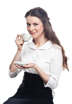 Young, beautiful and successful business woman drinking coffee from a white cup