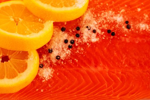 Salted salmon with lemon and pepper closeup