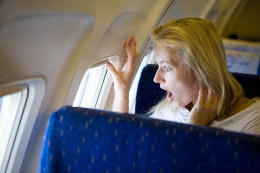 surprised girl in the airplane