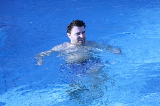 young attractive man relax in spa area