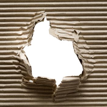 An image of hole in a piece of cardboard