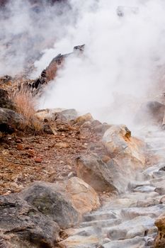 A valley of geysers in japanese mouintains
