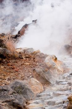 A valley of geysers in japanese mouintains
