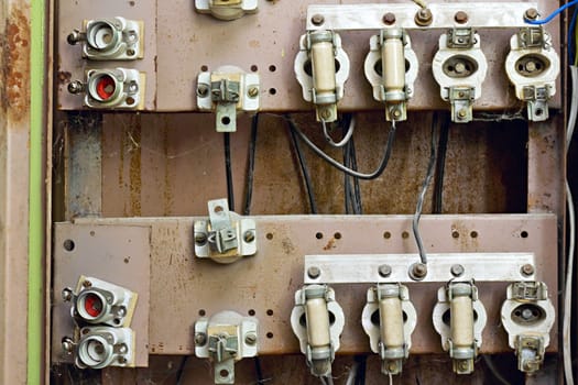 old switchboard with fuses in the background