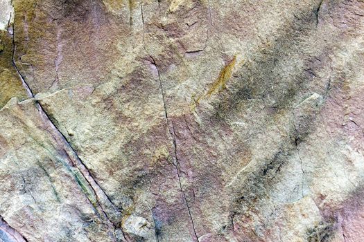 stone rock with cracks in the background