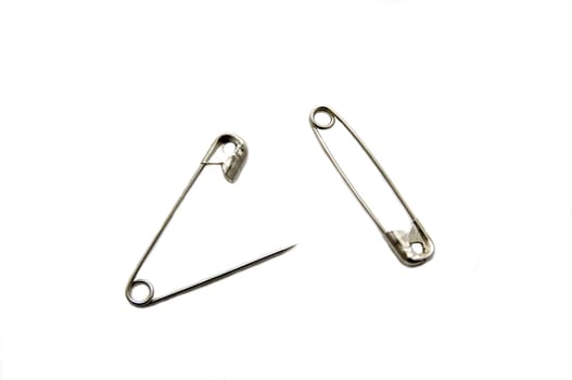 two safety pin on a white background