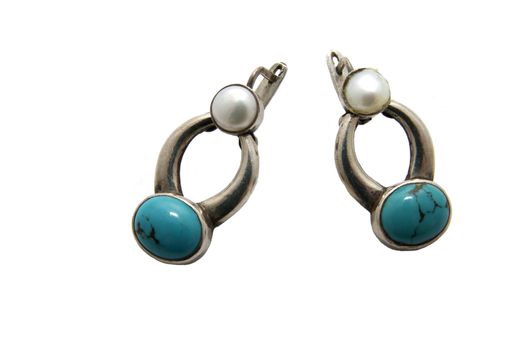 rings of precious metal with turquoise on a white background