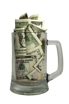 Money in the beer glass on white background
