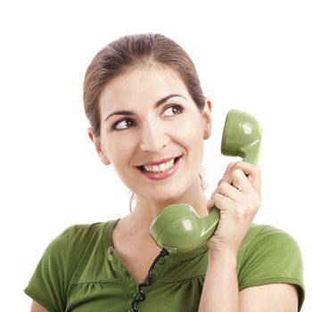 Beautiful woman holding and talking with a vintage phone