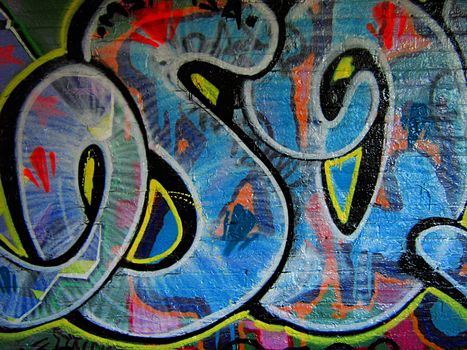 A photograph of graffiti on the side of an abandoned building.