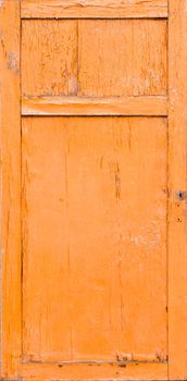Old door with cracked orange paint