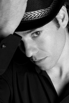 Handsome man portrait with hat black and white