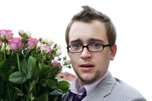 Young man with flowers smiling isolated on white background