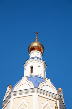 Golden domes of Christian church against the blue sky