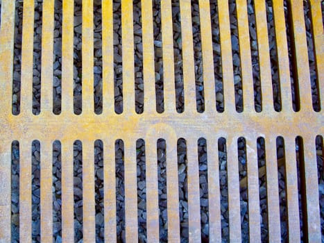 Yellowed ironwork on storm drain