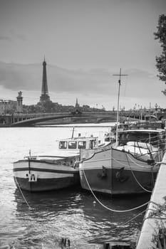 Living barge on the Seine in Paris with Eiffel tower background. France