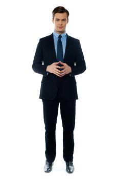 Confident executive standing in business suit isolated on white background