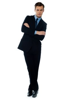 Young buisnessman tilting and smiling against white background