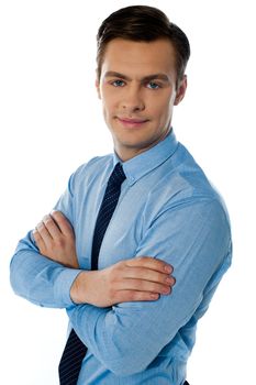 Businessman hposing with folded arms against white background