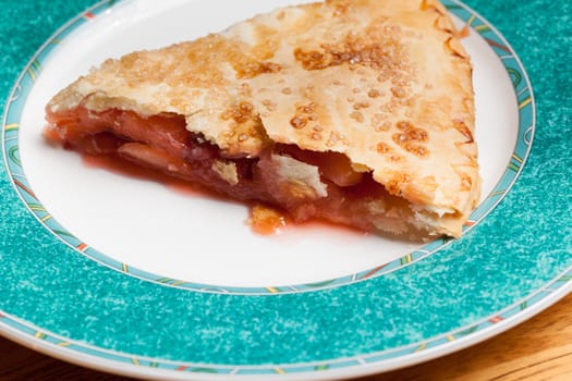 Home made baked fruit pie on plate in single serving
