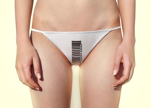 part of woman which is dressed in panties with barcode