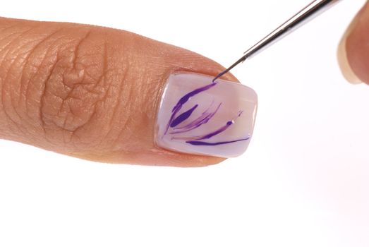 Manicurist working with a brush