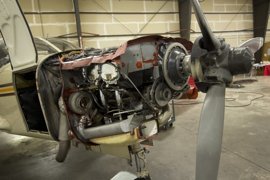 Small airplanes in the shop at an airport.