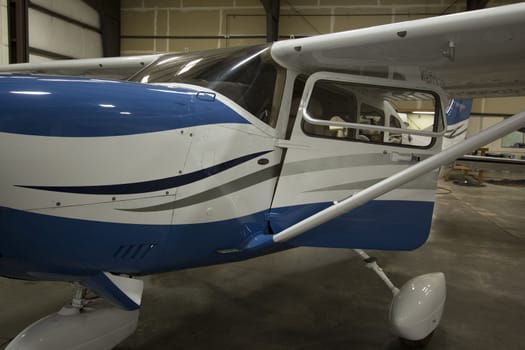 Small airplanes in the shop at an airport.