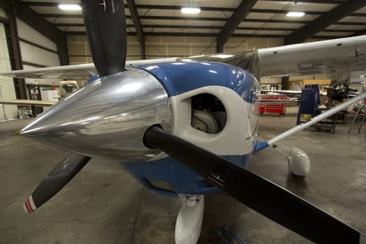 Small airplanes in the shop at an airport.