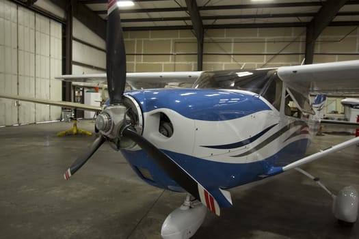 Small airplanes in the shop at an airport.