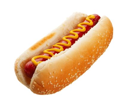 An old-fashioned hot dog with mustard, on a sesame seed bun.  Shot on white background.