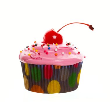 Delectable pink cupcake topped with a cherry and multi-colored sprinkles.  Shot on white background.