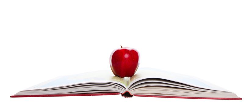 A rosey, red apple on a school atlas.