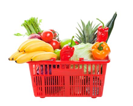 A grocery basket filled with fresh fruits, vegetables, and canned goods.  Shot on white background.