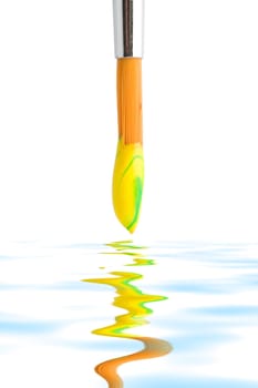 Stock photo: an image of a brush with yellow paint on it
