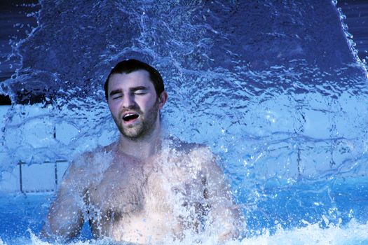 young attractive man relax in spa area