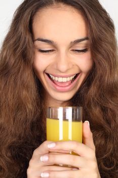Close-up portrait of woman with orange juice