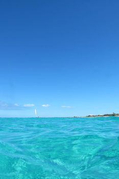 Image of a colorful tropical water and blue sky.