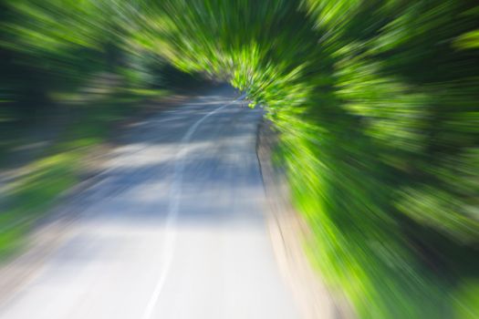 Speen drive motion blur road between trees